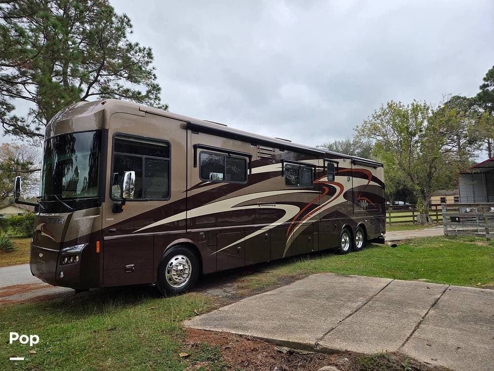 2010 Winnebago Grand Tour 42AD - Used Diesel Pusher For Sale by Pop RVs in Dickinson, Texas features Air Conditioning, Awning, Generator, Slideout