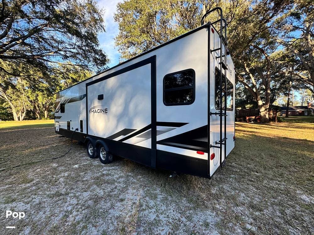 2024 Grand Design Imagine 2970RL - Used Travel Trailer For Sale by Pop RVs in San Antonio, Florida features Awning, Air Conditioning, Slideout, Leveling Jacks