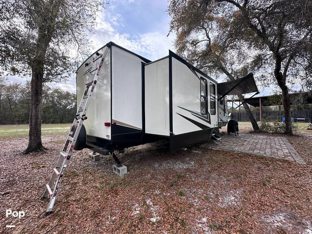 2022 Prime Time LaCrosse 3411RK - Used Travel Trailer For Sale by Pop RVs in Eustis, Florida features Air Conditioning, Awning, Slideout, Leveling Jacks