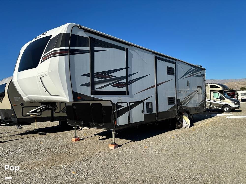 2022 Forest River Nitro XLR321 - Used Toy Hauler For Sale by Pop RVs in Indio, California features Generator, Leveling Jacks, Awning, Air Conditioning, Slideout
