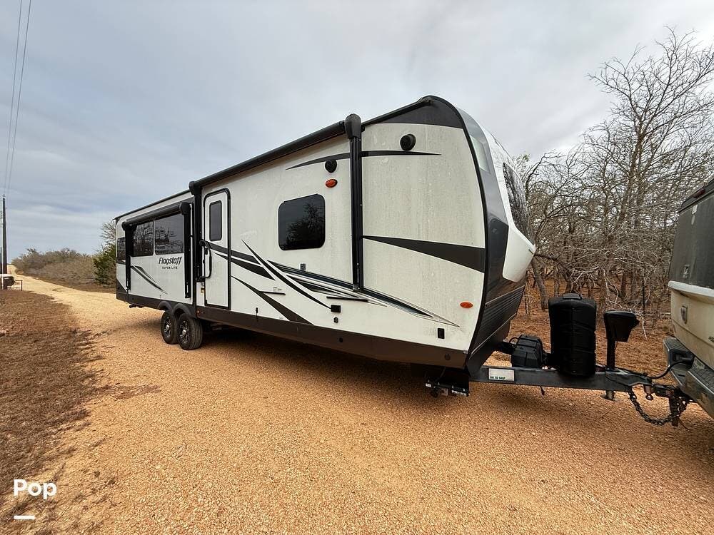 2022 Forest River Flagstaff 29RLBS - Used Travel Trailer For Sale by Pop RVs in Red Rock, Texas features Air Conditioning, Leveling Jacks, Awning, Slideout
