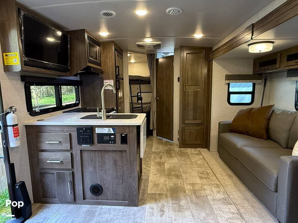 2023 Forest River Micro Lite 25BRDS - Used Travel Trailer For Sale by Pop RVs in Lakewood, Washington features Slideout, Leveling Jacks, Awning, Air Conditioning