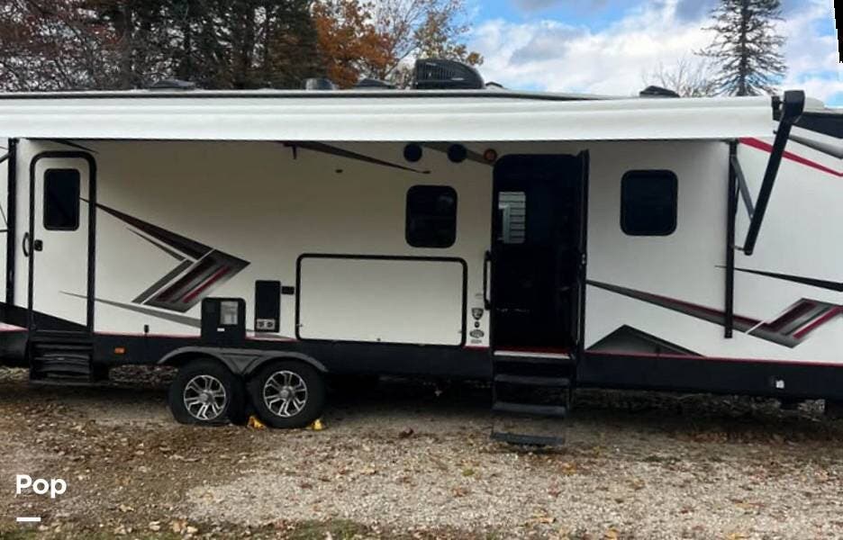 2022 Cruiser RV Stryker STG 3313 - Used Toy Hauler For Sale by Pop RVs in Michigan Center, Michigan features Slideout, Awning, Leveling Jacks, Air Conditioning, Generator