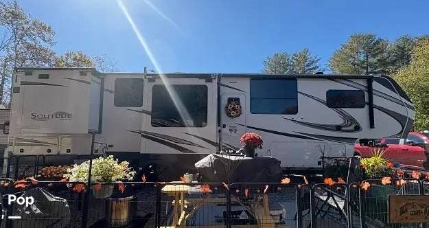 2023 Grand Design Solitude 390RK - Used Fifth Wheel For Sale by Pop RVs in Waynesville, North Carolina features Slideout, Air Conditioning, Leveling Jacks, Awning