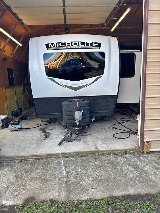 2025 Forest River Micro Lite 25FKB - Used Travel Trailer For Sale by Pop RVs in Van Buren, Arkansas features Slideout, Awning, Leveling Jacks, Air Conditioning