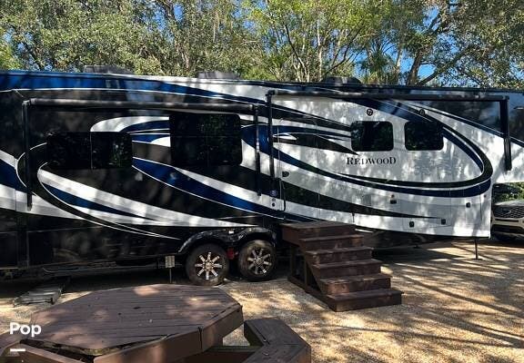 2019 CrossRoads Redwood 3901MB - Used Fifth Wheel For Sale by Pop RVs in River Ranch, Florida features Leveling Jacks, Air Conditioning, Slideout, Awning