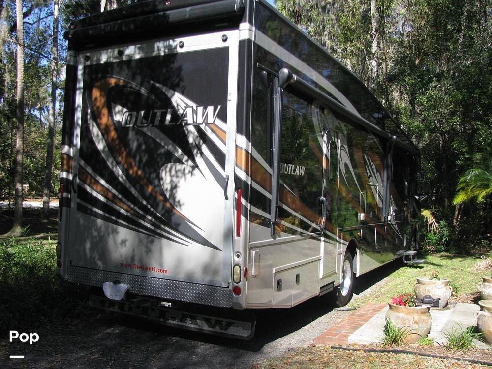 2017 Thor Motor Coach Outlaw 37BG - Used Toy Hauler For Sale by Pop RVs in New Smyrna Beach, Florida features Slideout, Generator, Awning, Leveling Jacks, Air Conditioning