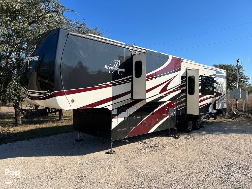 2019 Forest River RiverStone 39RKFB - Used Fifth Wheel For Sale by Pop RVs in Johnson City, Texas features Leveling Jacks, Awning, Generator, Slideout, Air Conditioning
