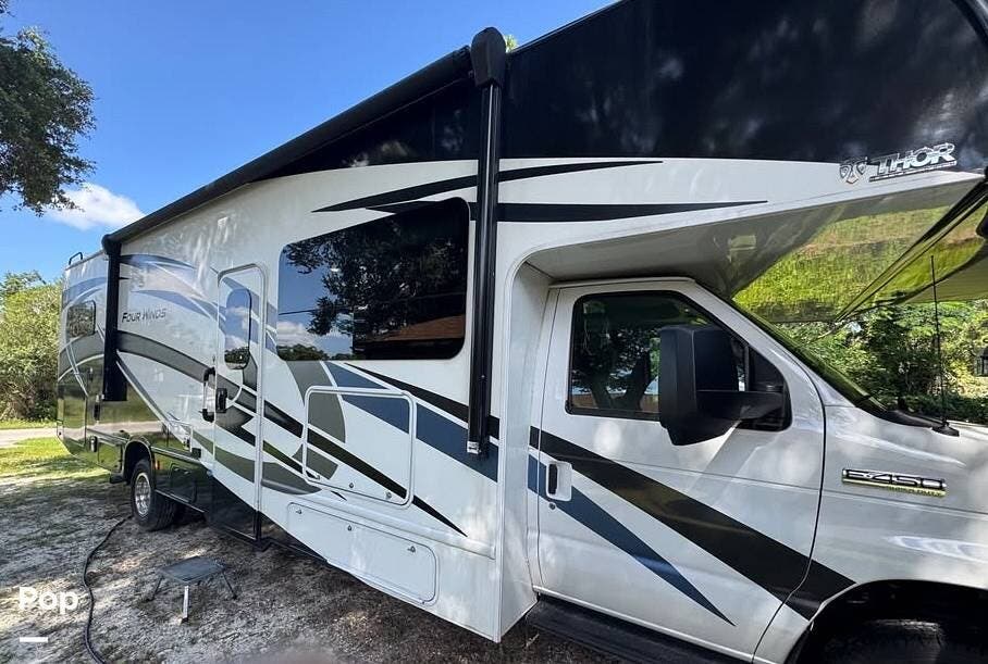 2023 Thor Motor Coach Four Winds 31E - Used Class C For Sale by Pop RVs in North Port, Florida features Air Conditioning, Slideout, Awning, Generator, Leveling Jacks