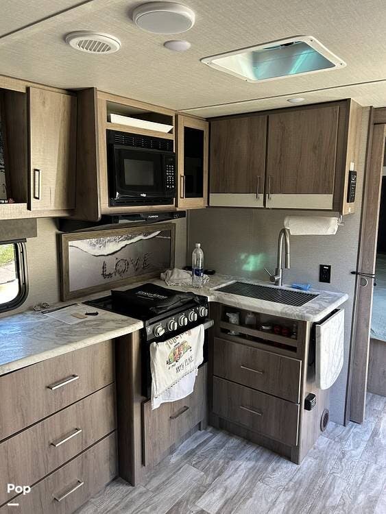 2022 Grand Design Imagine XLS 22 RBE - Used Travel Trailer For Sale by Pop RVs in Ocala, Florida features Slideout, Leveling Jacks, Air Conditioning, Awning