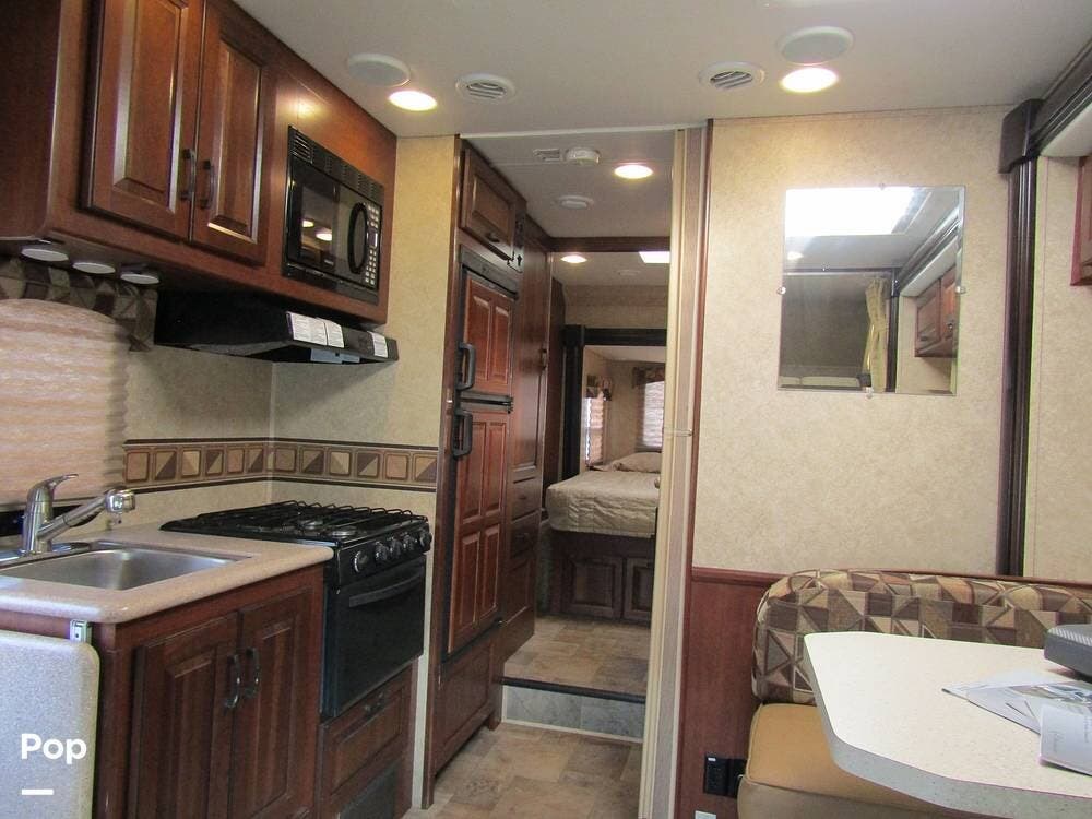 2014 Forest River Solera 24R - Used Class C For Sale by Pop RVs in Hixson, Tennessee features Generator, Leveling Jacks, Awning, Air Conditioning, Slideout