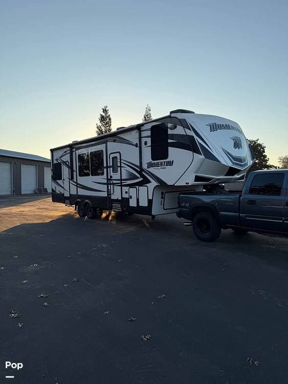 2015 Grand Design Momentum 328M - Used Toy Hauler For Sale by Pop RVs in Dinuba, California features Slideout