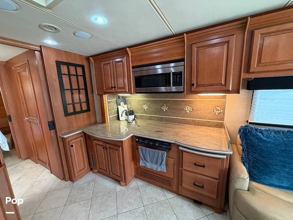 2010 Damon Tuscany 3680 - Used Diesel Pusher For Sale by Pop RVs in Rosenberg, Texas features Slideout, Awning, Generator, Leveling Jacks, Air Conditioning