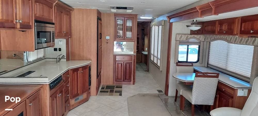 2006 Thor Motor Coach Mandalay 40E - Used Diesel Pusher For Sale by Pop RVs in Bradenton, Florida features Slideout, Leveling Jacks, Air Conditioning, Awning, Generator