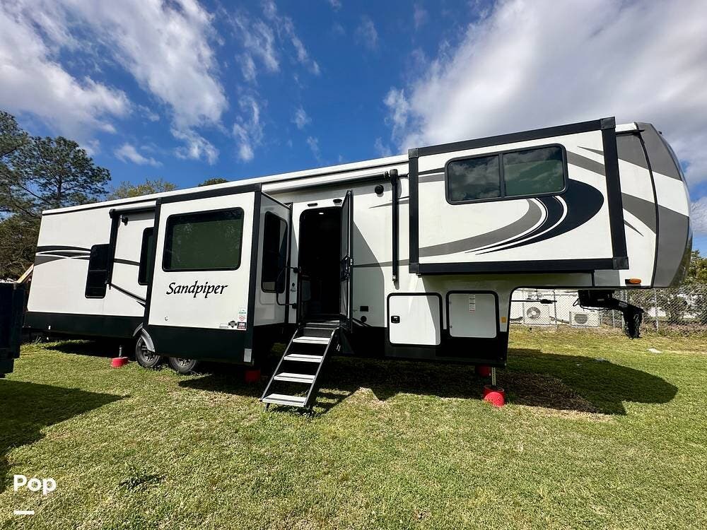 2023 Forest River Sandpiper 3990FL - Used Fifth Wheel For Sale by Pop RVs in Leland, North Carolina features Awning, Air Conditioning, Leveling Jacks, Slideout