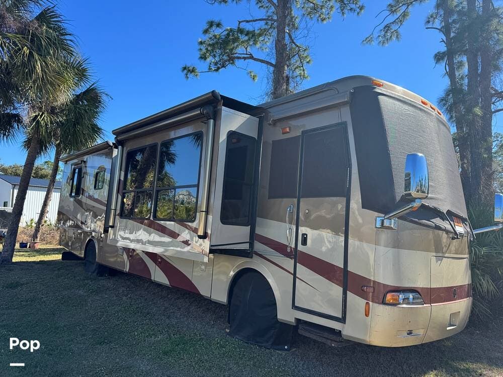 2006 Holiday Rambler Endeavor 40PAQ - Used Diesel Pusher For Sale by Pop RVs in North Port, Florida features Generator, Slideout, Awning, Leveling Jacks, Air Conditioning