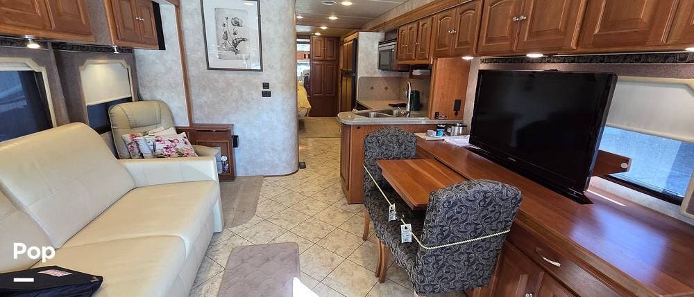 2011 Winnebago Journey Express 34Y - Used Diesel Pusher For Sale by Pop RVs in Plano, Texas features Awning, Slideout, Air Conditioning, Generator, Leveling Jacks