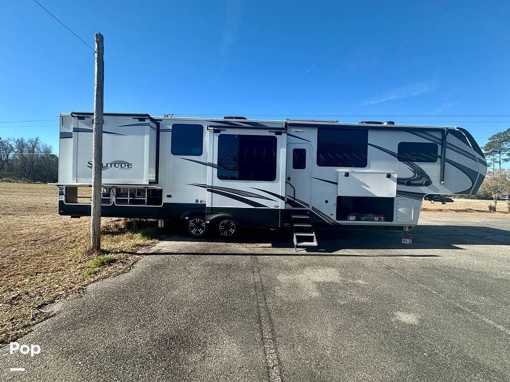 2023 Grand Design Solitude 390RK - Used Fifth Wheel For Sale by Pop RVs in Longs, South Carolina features Leveling Jacks, Air Conditioning, Awning, Slideout