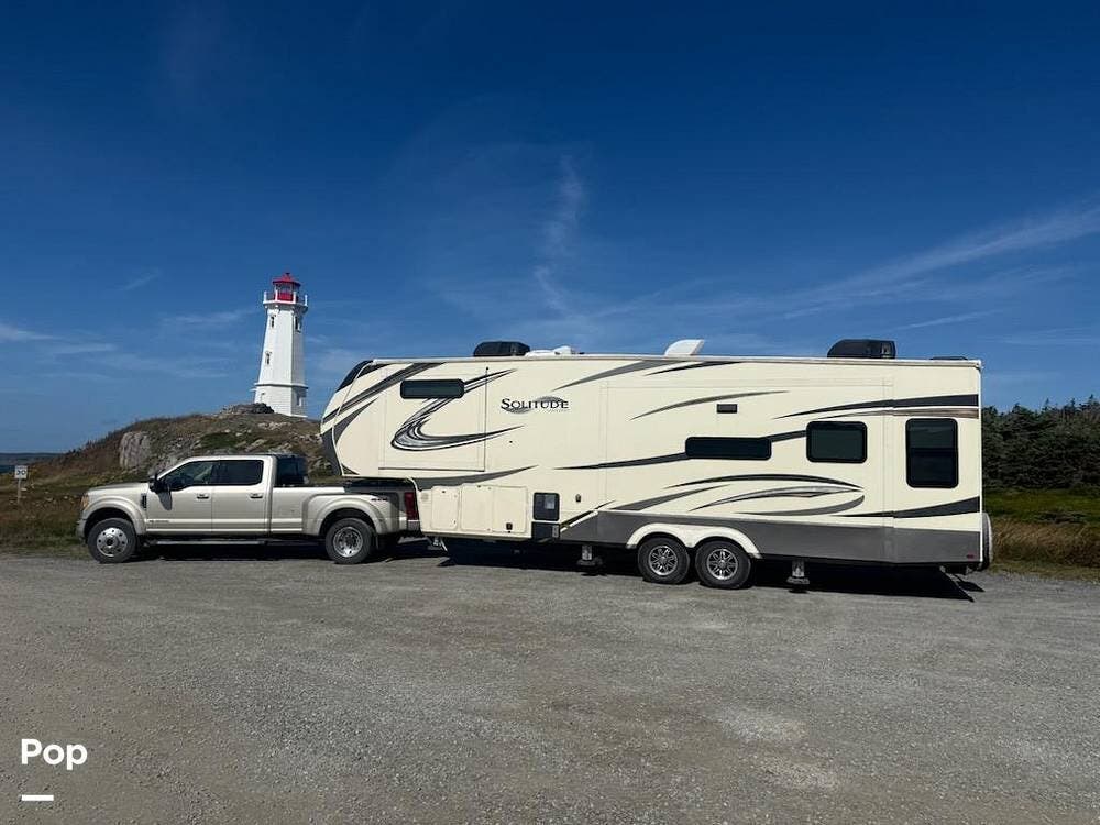 2021 Grand Design Solitude 310GK-R - Used Fifth Wheel For Sale by Pop RVs in Hutchinson, Kansas features Awning, Leveling Jacks, Slideout, Air Conditioning