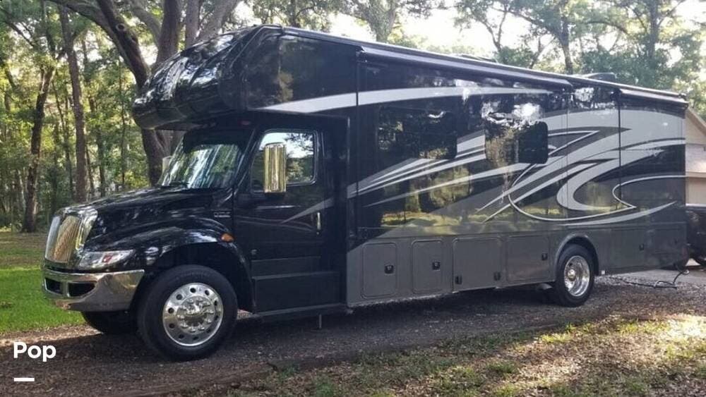 2023 Nexus Wraith 32W - Used Super C For Sale by Pop RVs in Dade City, Florida features Generator, Slideout, Leveling Jacks, Air Conditioning, Awning