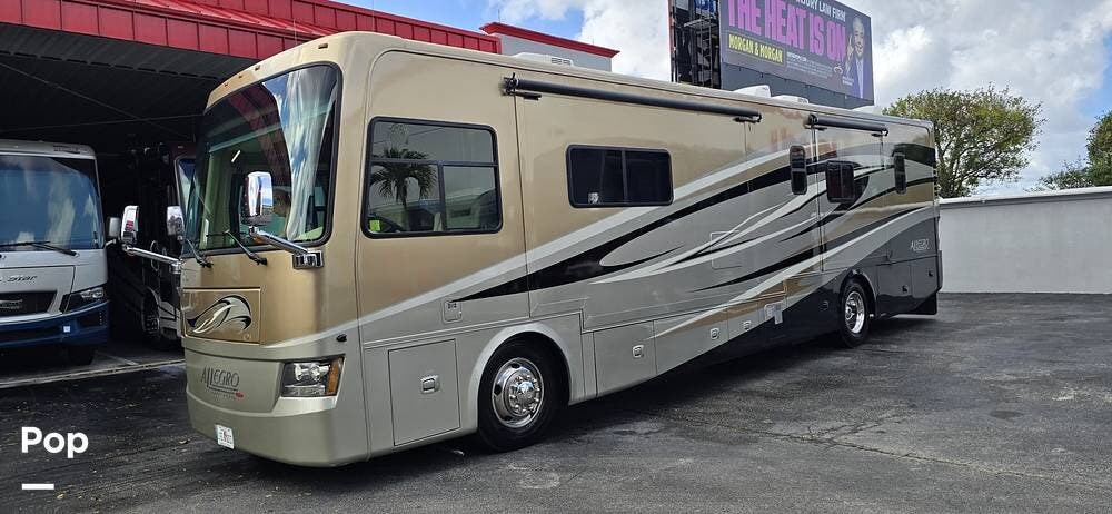 2012 Tiffin Allegro Red 38QRA - Used Diesel Pusher For Sale by Pop RVs in Boynton Beach, Florida features Leveling Jacks, Generator, Air Conditioning, Slideout, Awning
