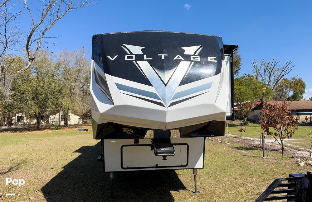 2024 Dutchmen Voltage 4271 - Used Toy Hauler For Sale by Pop RVs in Kissimmee, Florida features Leveling Jacks, Air Conditioning, Awning, Slideout, Generator