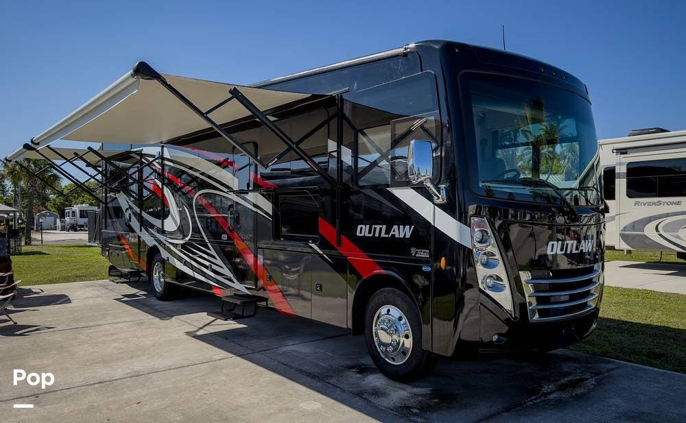2022 Thor Motor Coach Outlaw 38KB - Used Toy Hauler For Sale by Pop RVs in Bowling Green, Florida features Awning, Air Conditioning, Leveling Jacks, Generator, Slideout