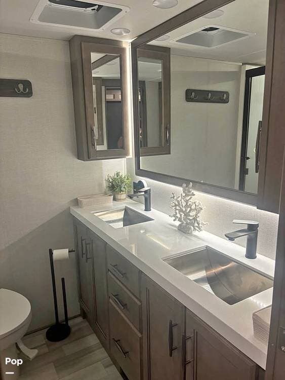 2024 Grand Design Solitude 390RK - Used Fifth Wheel For Sale by Pop RVs in Apollo Beach, Florida features Slideout, Leveling Jacks, Air Conditioning, Awning