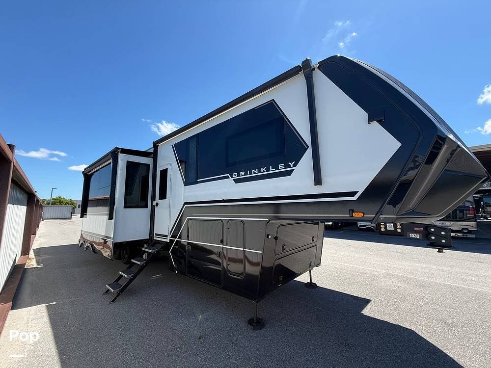 2025  Brinkley G Series 3950 - Used Toy Hauler For Sale by Pop RVs in Largo, Florida features Leveling Jacks, Slideout, Generator, Awning, Air Conditioning