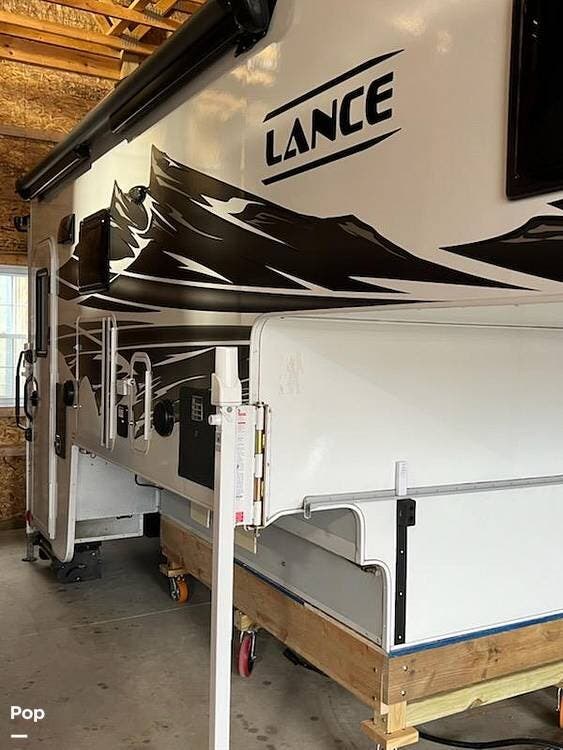 2022 Lance Lance 1172 - Used Truck Camper For Sale by Pop RVs in Casco, Michigan features Slideout