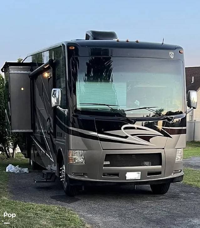 2014 Thor Motor Coach Outlaw 37MD - Used Toy Hauler For Sale by Pop RVs in Waterford, Wisconsin features Awning, Air Conditioning, Generator, Slideout, Leveling Jacks