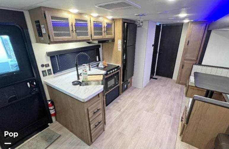 2025 Forest River Cherokee Wolf Den 301BH - Used Travel Trailer For Sale by Pop RVs in Madison, New Hampshire features Slideout