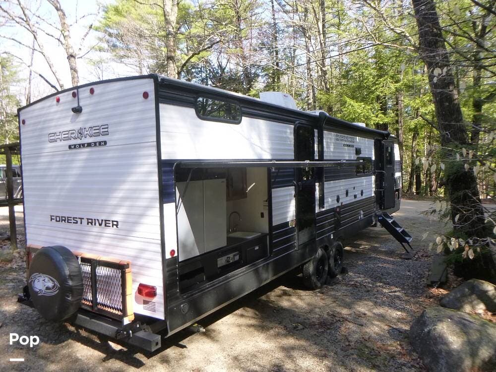 2025 Forest River Cherokee Wolf Den 301BH - Used Travel Trailer For Sale by Pop RVs in Madison, New Hampshire features Leveling Jacks, Air Conditioning, Slideout, Awning