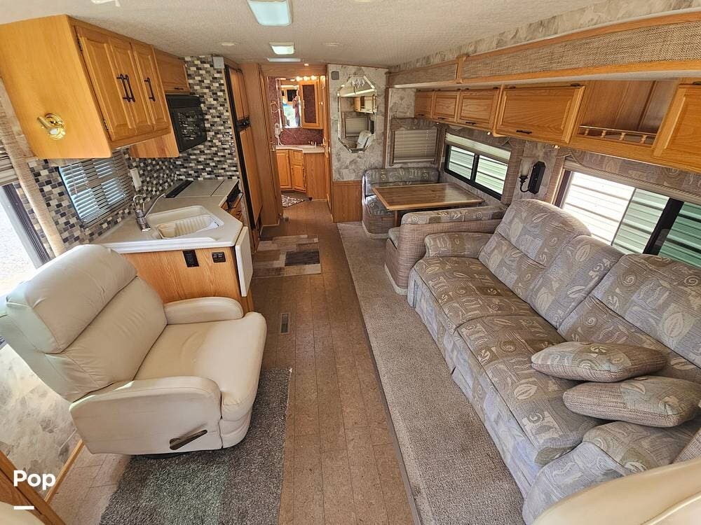 2004 Winnebago Journey 36G - Used Diesel Pusher For Sale by Pop RVs in Camp Verde, Arizona features Awning, Air Conditioning, Leveling Jacks, Slideout, Generator