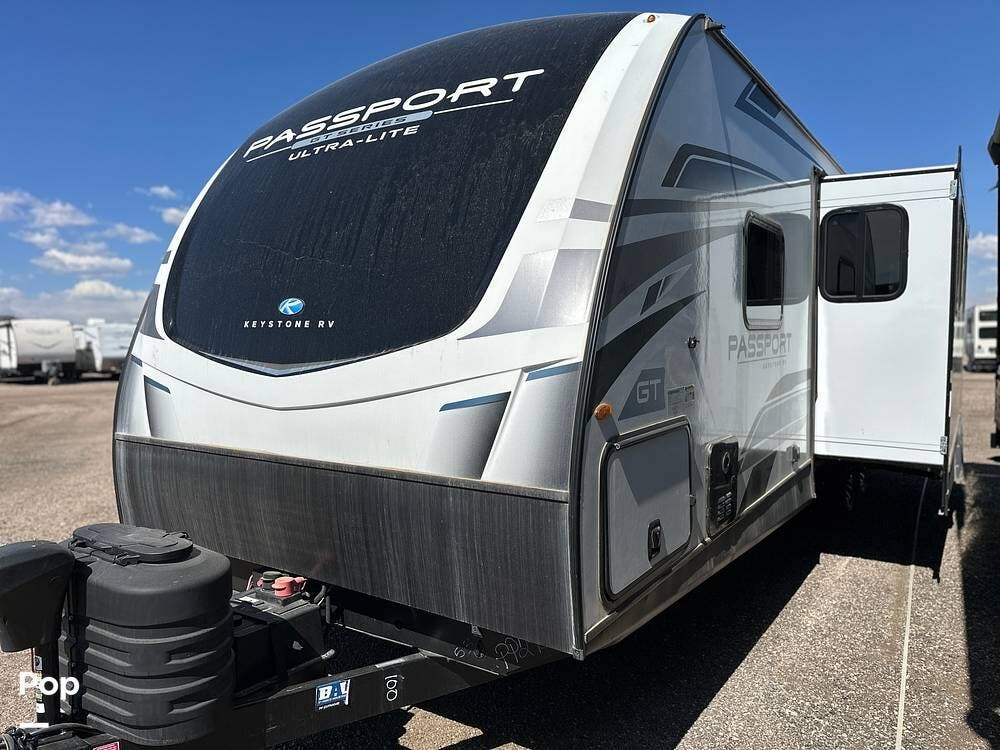 2023 Keystone Passport 2951BH - Used Travel Trailer For Sale by Pop RVs in Windsor, Colorado features Leveling Jacks, Awning, Air Conditioning, Slideout