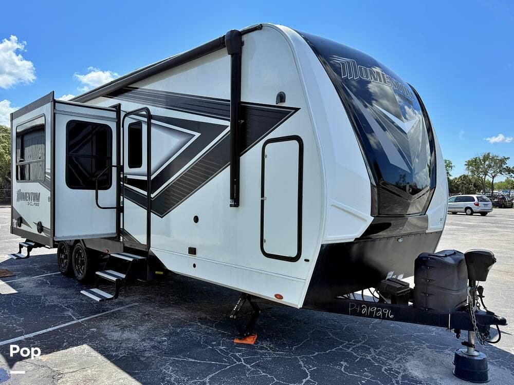 2023 Grand Design Momentum 29G - Used Toy Hauler For Sale by Pop RVs in Tarpon Springs, Florida features Air Conditioning, Awning, Slideout, Generator, Leveling Jacks