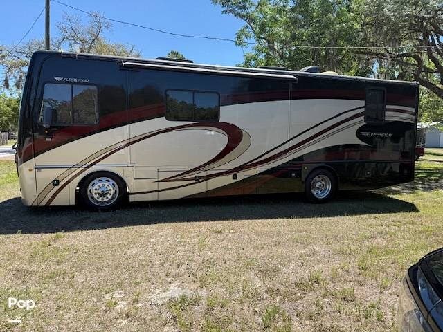 2013 Fleetwood Excursion 33A - Used Diesel Pusher For Sale by Pop RVs in New Port Richey, Florida features Air Conditioning, Slideout, Leveling Jacks, Awning, Generator