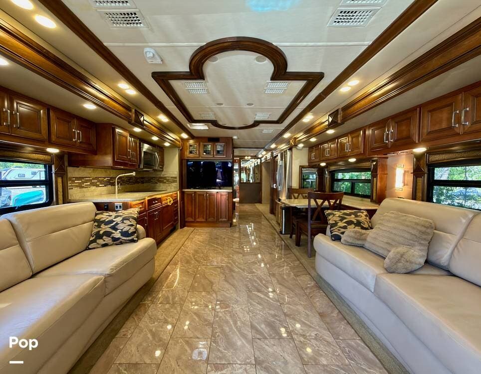 2014 American Coach American Revolution 42W - Used Diesel Pusher For Sale by Pop RVs in Fleming Island, Florida features Generator, Slideout, Awning, Air Conditioning, Leveling Jacks