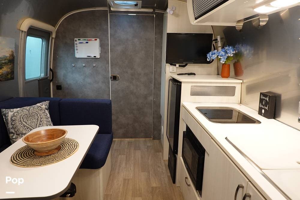 2021 Airstream Bambi 22FB - Used Travel Trailer For Sale by Pop RVs in Austin, Texas features Awning, Air Conditioning, Leveling Jacks