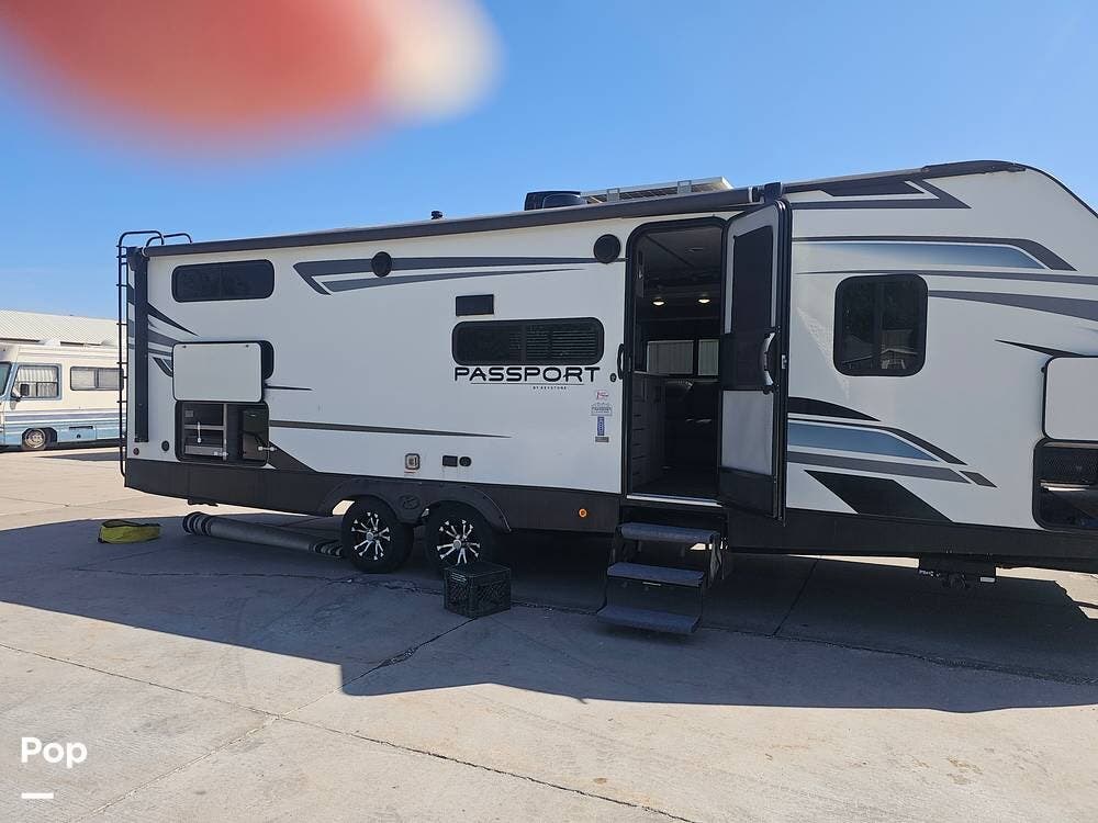 2022 Keystone Passport 268BH - Used Travel Trailer For Sale by Pop RVs in Johnston, Iowa features Air Conditioning, Leveling Jacks, Slideout, Awning