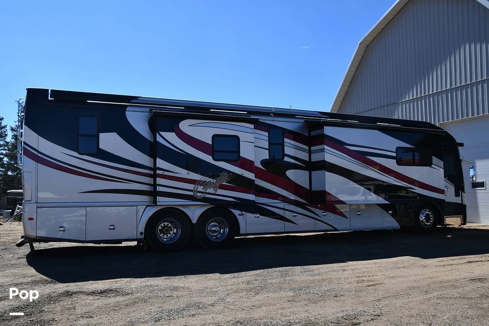 2009 American Coach American Eagle 45E - Used Diesel Pusher For Sale by Pop RVs in Granby, Colorado features Slideout, Leveling Jacks, Awning, Generator, Air Conditioning