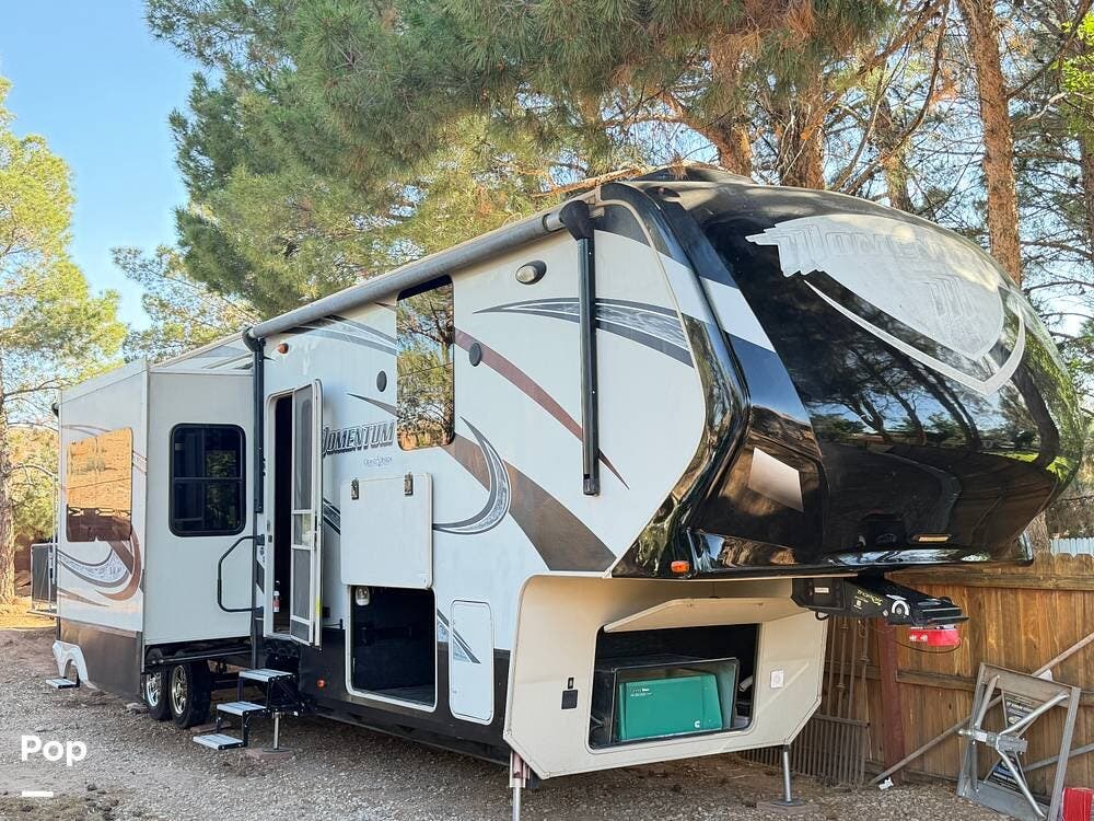 2015 Grand Design Momentum 385TH - Used Toy Hauler For Sale by Pop RVs in St George, Utah features Air Conditioning, Slideout, Leveling Jacks, Generator, Awning