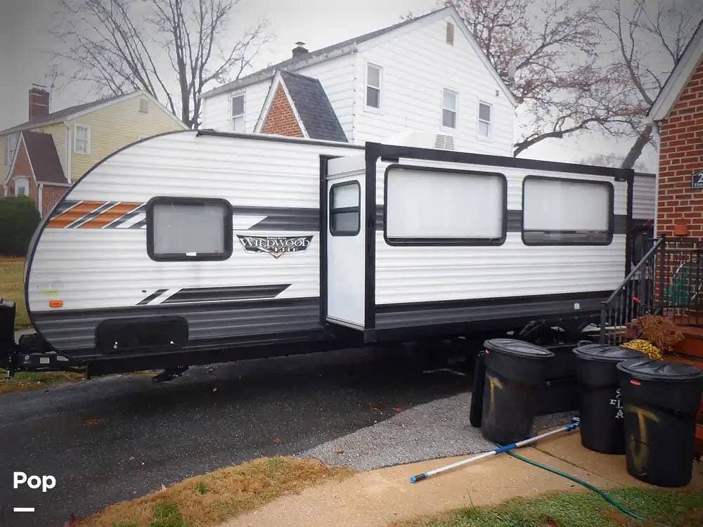 2022 Forest River Wildwood 273QBXL - Used Travel Trailer For Sale by Pop RVs in Parkville, Maryland features Air Conditioning, Awning, Slideout
