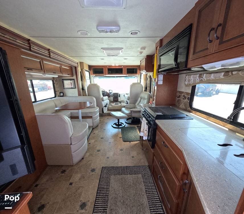 2012 Thor Motor Coach Hurricane 29X - Used Class A For Sale by Pop RVs in Seal Beach, California features Awning, Generator, Leveling Jacks, Air Conditioning, Slideout