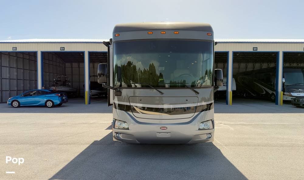 2010 Winnebago Journey Express 34Y - Used Diesel Pusher For Sale by Pop RVs in Lakeland, Florida features Slideout, Generator, Leveling Jacks, Air Conditioning, Awning