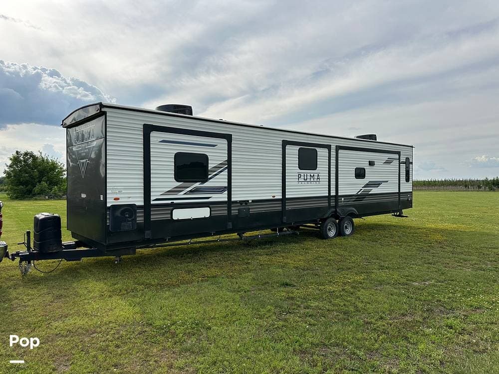 2023 Palomino Puma 38RLB - Used Travel Trailer For Sale by Pop RVs in Independence, Missouri features Leveling Jacks, Awning, Slideout, Air Conditioning