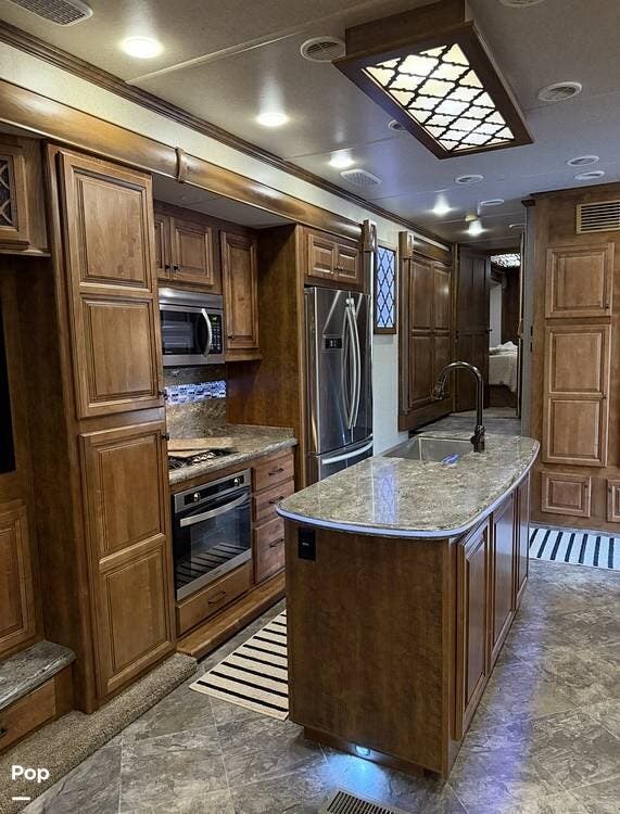 2018 Heartland Landmark 365 Oshkosh - Used Fifth Wheel For Sale by Pop RVs in Clovis, California features Awning, Slideout, Leveling Jacks, Air Conditioning