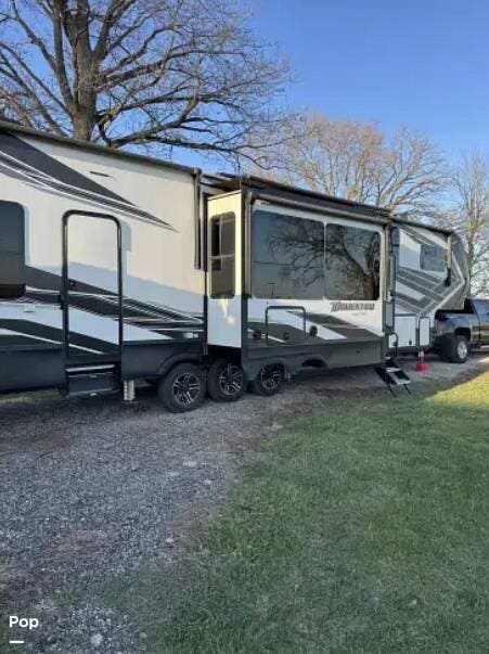 2022 Grand Design Momentum 397TH - Used Toy Hauler For Sale by Pop RVs in Streator, Illinois features Leveling Jacks, Air Conditioning, Slideout, Generator, Awning