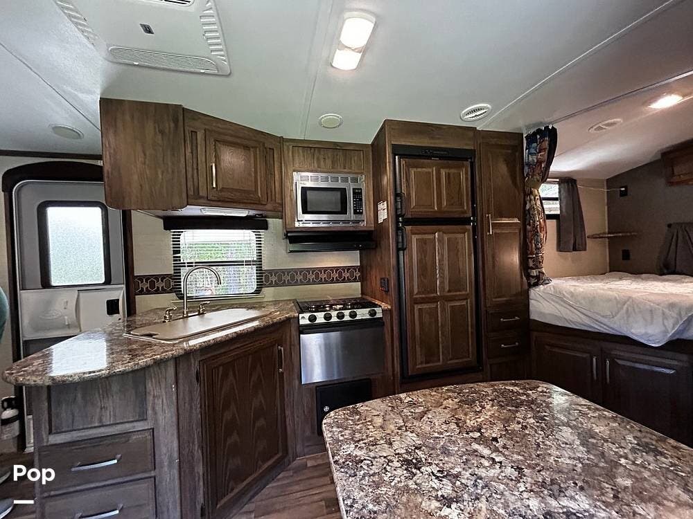 2016 Keystone Cougar X-LITE 25rdb - Used Travel Trailer For Sale by Pop RVs in Mckenney, Virginia features Leveling Jacks, Awning, Air Conditioning, Slideout