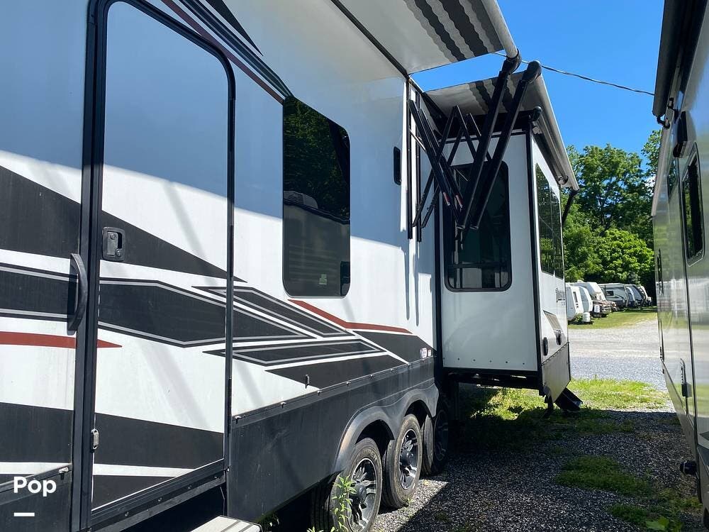 2022 Grand Design Momentum 398M - Used Toy Hauler For Sale by Pop RVs in Lebanon, Pennsylvania features Slideout, Awning, Air Conditioning, Leveling Jacks, Generator